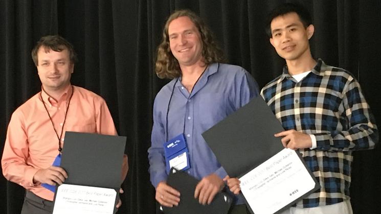 Gubanov, Jermaine, and Luo holding awards