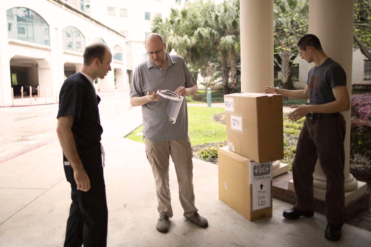 Roland von Kurnatowski ’04 (center) distributes PPE to Memorial Hermann hospital. Photo courtesy of TXRX Labs