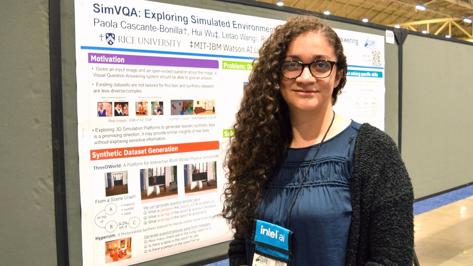 Cascante-Bonilla standing in front of a poster of her computer vision research