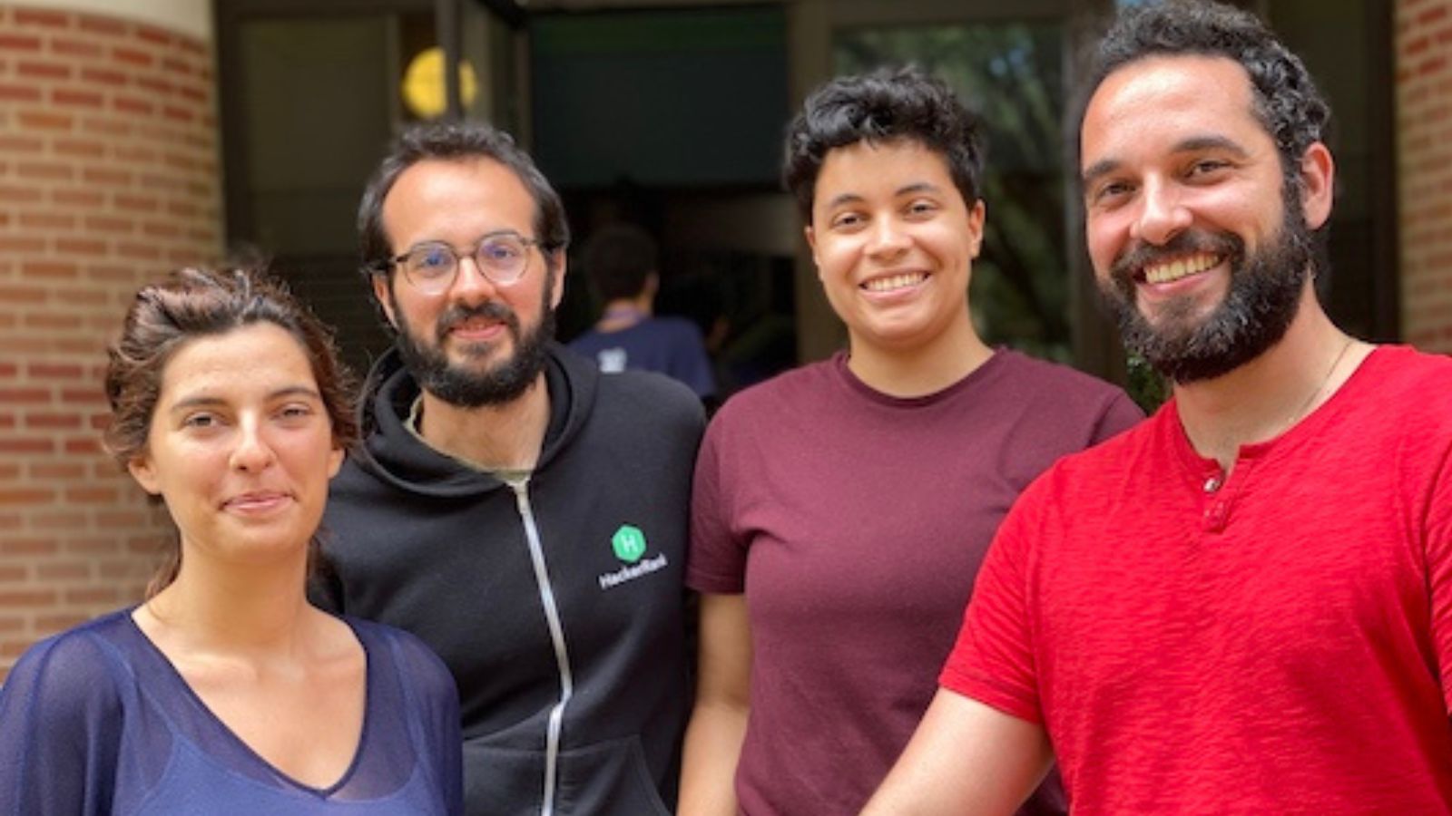 Four Kavraki Lab grad students standing outside at Rice University
