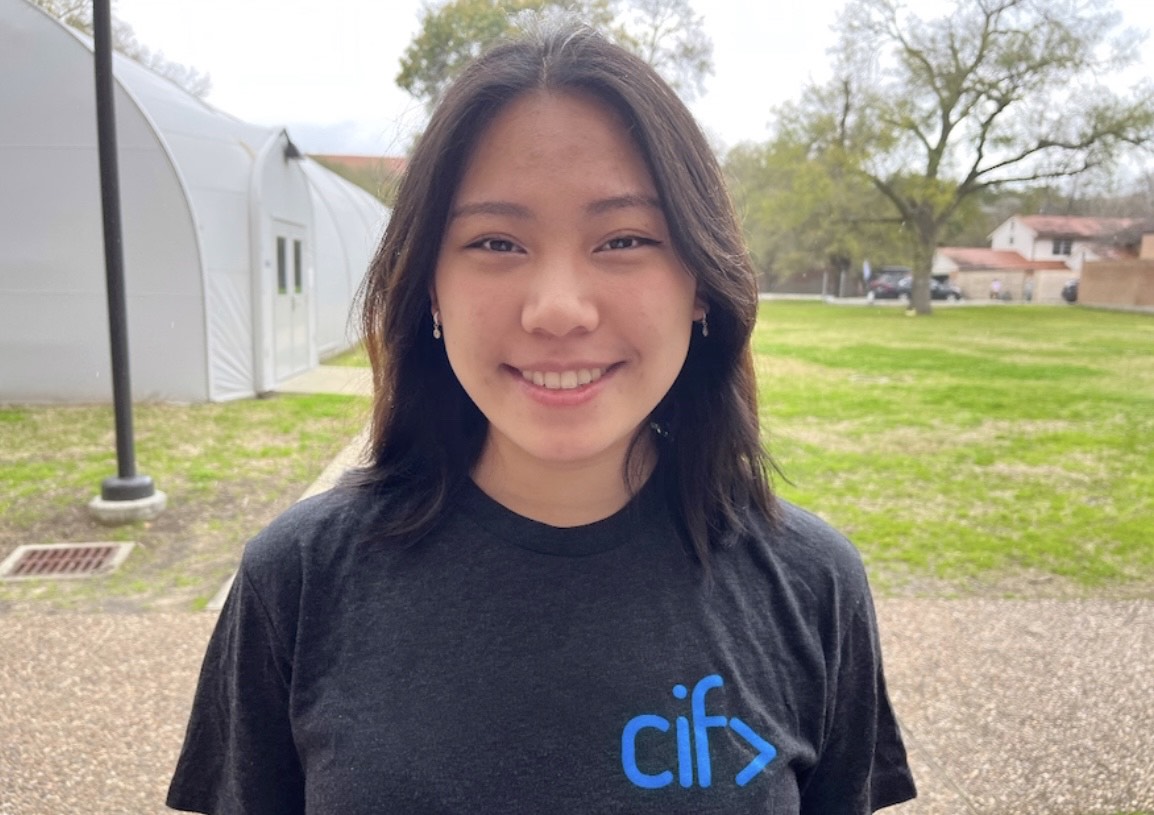 Female student standing outside on the Rice University campus