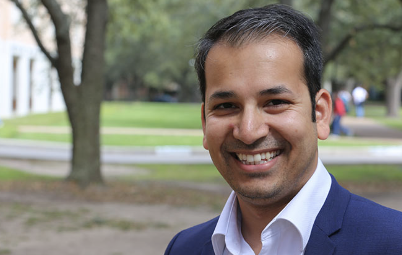 Faculty member Anshumali Shrivastava standing outdoors on the Rice University campus 