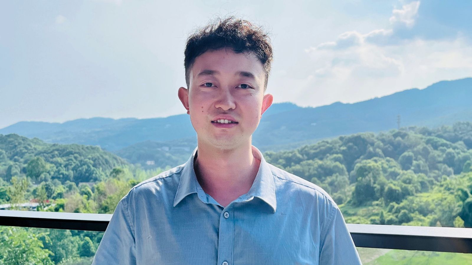 Rice CS Ph.D. student Zhiwei Zhang standing outside