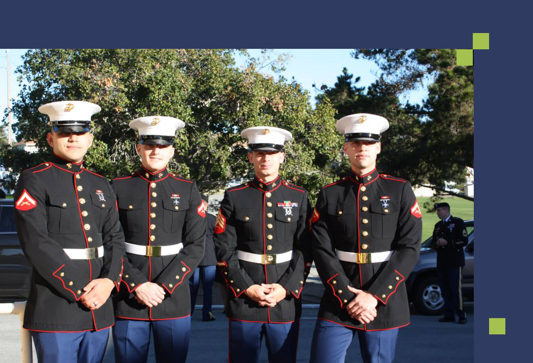 Three marines pose in front of a car, showcasing their uniforms and camaraderie.