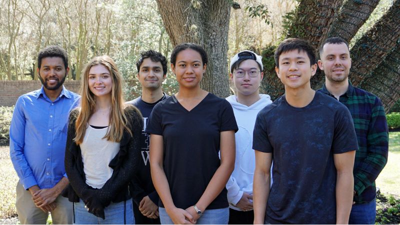 Rice University students and faculty standing outside on campus